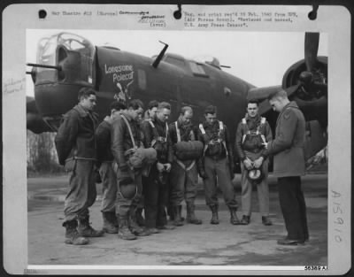 General > Capt. James A. Burriss, Chaplain at an Air force station somewhere in the ETO, leads ground and flight crews of the "Lonesome Polecat" in prayer before they take off on a mission over Hitler-held Europe.