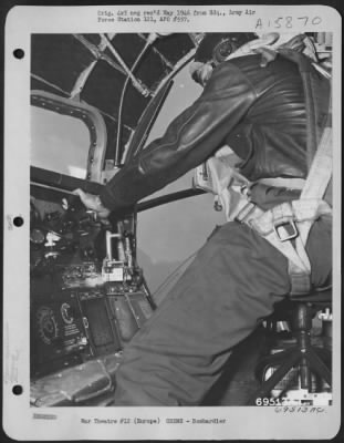 General > Five Miles Above The Target, The Oxygen-Masked Group Bombardier, Lt. Samuel M. Slaton Of Town Creek, Alabama, Calls "Bombs Away" Over The Interphone, Pulls The Bomb Release Lever, And Leans Forward Over The Plexi-Glass Nose To Watch Them To The Point Of I