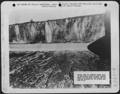 Thumbnail for Radar > Oblique Showing Enemy Wurzburg Radar, Pole-Type Beach Obstacles, And Gun Positions Burrowed Into The Cliffside Near Point De Hoe, France.