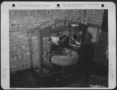 Thumbnail for General > Gi Ingenuity Takes Strange Twists - Gi Gadgets Have Saved Many Hours And Made Tedius Tasks Easier.  Here, M/Sgt. Donald A. Guger Of Muskegon, Mich., Demonstrates His Invention Of A Wheel Straighter For All Types Of Vehicles.  For His Exemplary Work He Was