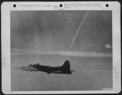 Thumbnail for Vapor Trails > V-2 ROCKET PATTERN--This unusual photograph shows the contrail of a V-2 rocket, launched by the Germans into the skies over France, during the U.S. 8th Air force's attack on Hamburg, Harburg, and Neiumunster, Germany, November 6, 1944. The jagged