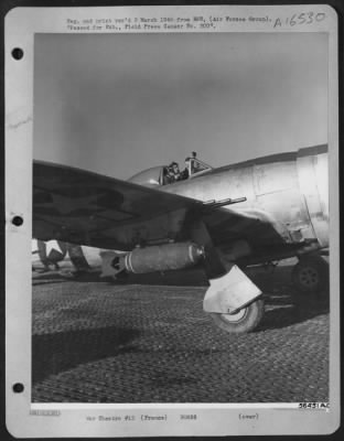 Thumbnail for General > FANGS BARED----Showing teeth that range from caliber .50 bullets through 100-pound white phosphorous bomb to 500-pound H.E. bombs, this Republic P-47 Thunderbolt of the First Tactical A.F. stands ready for another bite at the Hun.