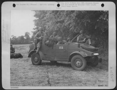 General > "Somewhere in France," Pvt. Lavern Bick, Joliet, Ill., Cpl. Bill Stone, Heleyville, Ala; Pvt. Joe Spinner, Indiana, Pa., Sgt. Lee C. Draus, Malone, Wisc., and S/Sgt. John B. Upchurch of Fayetteville, N.C., in a German jeep. The American Star