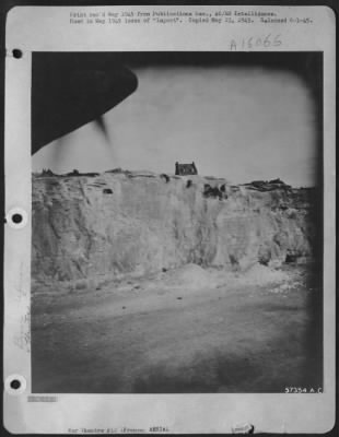 Consolidated > Detailing Information On Normandy Beach Defenses Was Obtained From "Dicing" Shots Like This.  Shown Here Are Gun Positions In Caves And Barbed Wire Entanglements Along The Top Of Cliffs Northest Of Dieppe, France.  Photo Taken By 1St Lt. Albert Lanker, 10