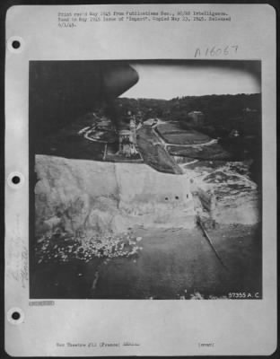 Consolidated > Detailing Information On Normandy Beach Defenses Was Obtained From "Dicing" Shots Like This.  Three Tunnels Or Artificial Caves, Similar To Installations Encountered By The Canadians At Dieppe In 1942, Are Spotted East Of Le Treport, France.  Affording Ex