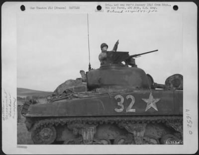 Thumbnail for General > Cpl. Charles Reigiart, Red Lion, Pa., Gunner On A Sherman Tank, Sticks His Head Out For A View Of The 9Th Air Force Planes That Are Supporting His Unit Near The Front.  France, 13 October 1944.