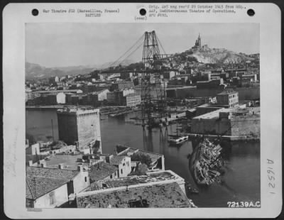 Thumbnail for General > Marseilles, France -- Shown On Hill In Background, Is The Church Of Notre Dame De La Garde And At Right, Foreground, Is French Merchant Ship 'Cap Corse' Which Was Scuttled By The Germans To Block Entrance To The Harbor.