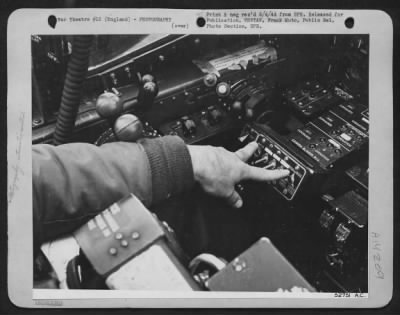 Cameras,Gun > High over the target, Lt. Schultz, turns the switches that control the battery of automatic aerial cameras in the nose of his Lockheed P-38 Lightning, photo-reconnaissance plane. As he flies over the objective to be mapped, these cameras will make an