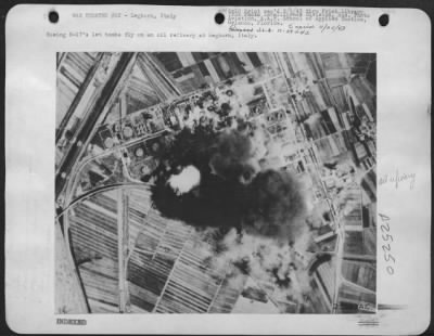 Consolidated > Boeing B-17's let bombs fly on an oil refinery at Leghorn, Italy.