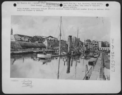 Consolidated > Large drydock, containing damaged 280-foot merchant vessel & 150-foot coaster (2 & 3 on vertical 27493 A.C.) was flooded by Germans.