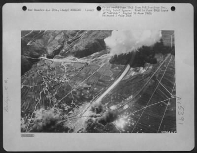 Consolidated > Italy-Main rail bridge and a diversion pass at Ora on the Brenner Line were blasted on 20 April 1945 by 12th AF North American B-25 Mitchells. White smoke of phosphorous bombs envelope anti-aircraft positions at upper right and helps cut down flak