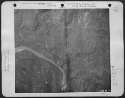 Consolidated > MARAUDERS GIVE AXIS BRIDGE THE "ONE-TWO-THREE." This sequel of photos show one day's work in the long-range program of medium bombardment to knock out Axis communications in Italy. Headed right straight for the bridge is this