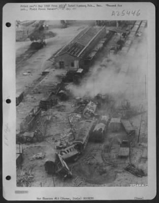 Consolidated > This railroad yard to Parma, Italy is a bottleneck in the Nazi communications system in Northern Italy, following attacks by Republic P-47 Thunderbolts of the U.S. 12th A.F. A pall of smoke hangs over the destroyed goods wagons and the wrecked rails