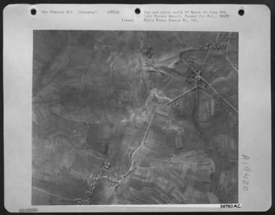 Consolidated > The track-marked terrain (left center) in this aerial photograph taken from a 1st Tac. Air Force Martin B-26 Marauder reveals the site of a 7th Army tank battle with the enemy somewhere on the 6th Army Group front driving toward the Saar Palatinate.
