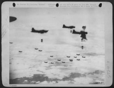 Thumbnail for Flak > BOMBS AND FLAK: As flak burst near the lead plane, 8th AAF Flying Fortresses drop their bombs on Leipzig, in Central Germany, during Sunday's (Feb 20) All-American attack on Nazi aircraft factories.