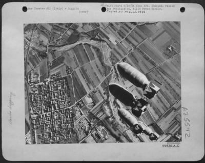 Thumbnail for Consolidated > Tons of bridge bursters pointed for the Pontecurone rail bridge, behind the German Gothic Line in northern Italy, are pin pointed smack on their target in an excellent concentration. This is one of the many communications links that B-26 Marauders of