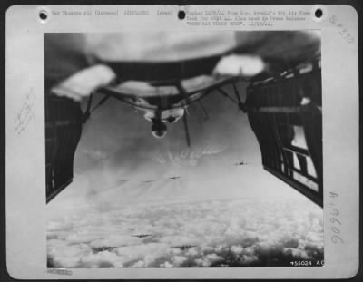 Boeing > BOMB BAY DOORS OPEN-The open bomb bay doors of a Flying Fortress frame this view of B-17 bombers steady on the target for an attack on Merseburg/Leuna, German oil plant.
