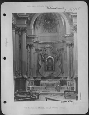 Consolidated > ITALY-In Rimini, after bombers, artillery, and battleships had pounded the city, few buildings were left untouched. Among those in which little damage was done was this massive church, miraculously spared among shattered buildings. Coming down the