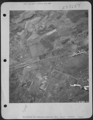 Consolidated > Italy-On the way to start fires and destruction on the Ciampino South Airdrome, near Rome, are these clusters of fragmentation bombs. The hangars and dispersal areas of the field are seen at bottom of the picture, as they looked before Martin B-26