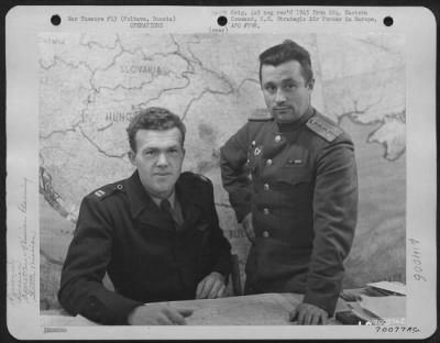 General > Capt. Finchen And A Russian Officer Discuss Future Shuttle Bombing Missions To Be Flown From The Poltava Airbase In Russia, Sometime In November 1944.