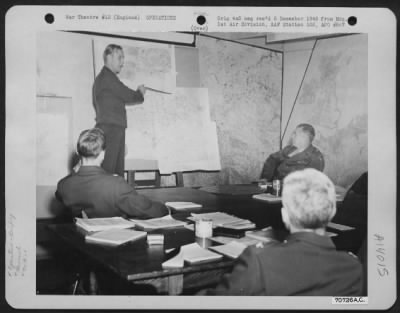General > Brig Gen Frank Armstrong (Far Right) And Other Officers Are Briefed On 8Th Air Force Missions At Hdq., 1St Bomb Division, Based In England, On 7 July 1943.