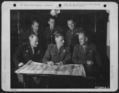 General > General Spaatz Confers With Other Generals Of His Command At An Air Base In England.  They Are, Left To Right: Major General Ralph Royce, Lt. General Carl Spaatz, Major General Hugh J. Knerr.  Standing, Left To Right: Brig. Gen. Edward P. Curtis, Major Ge