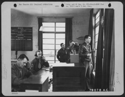 General > In The Control Tower At A U.S. Bomber Station These Men Perform One Of Their Tense Jobs Watching The Ships Return To Their Base.  Others Of The Control Tower Are Clearing Planes On And Off Field, Handling Mid-Air Traffic, Weather Forecasting And Answering