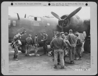 General > The Ground Crew Takes As Lively An Interest In Its "Own" Plane As Does The Combat Crew Itself.  Here The Ground Crew Waits To Hear How The Crew Of The Consolidated B-24 The "Exterminator" Made Out After The Plane Lands Having Completed A Combat Mission.