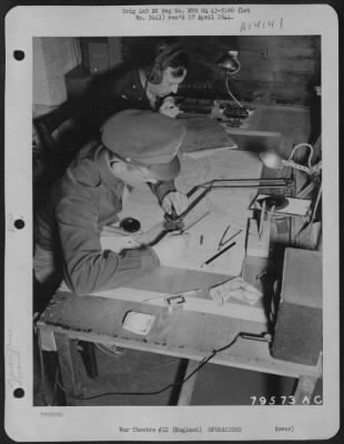 General > John M. Walch Of Pittsburgh, Pa., Navigation Instructor And 1St Lt. Jesse L. Mayo Of Saratoga, Texas, Navigation Instructor, Are Seen At Work In The Control Room At An Airbase At Bovington, England.  22 July 1943.