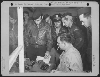 Thumbnail for General > Crew Members, Just Returned To Their Base At Bassingbourne, England From A Mission Over Enemy Territory, Look At A List Which Contains The Names Of Crews Who Did Not Get Back.  They Are, Left To Right: Capt. Richard W. Weitzenfeld Of Chicago, Ill., 1St Lt