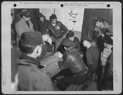 General > At Ridgewell Field, Great Yeldham, England, Colonel M. Cross, Riverside, Calif., Combat Wing Commander, Left, (Hand On Face) Tells The Story Of The Recent Rhur Valley Raid To Capt. Joseph M. Murray, Bar Harbor, Maine, Center; Lt. Colonel Conway S. Hall, N
