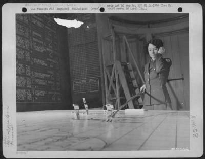 Thumbnail for General > Cpl. Geraldine Of Abilene, Texas, Attached To The 3Rd Bomb Division In England, Receives Reports On Aircraft Positions In The Plotting Room.  24 February 1944.