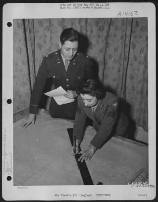 General > Lt. Colonel William H. Harkness Of Ny City Plots A Route For Fighter Planes To Follow On Riads, With The Aid Of Wac Sgt. Dorothy H. Clar Of East Jordan, Mich., At An 8Th Air Force Base At Watford, England.  11 January 1944.