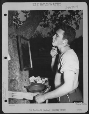 General > Sgt. Harry Williams Of Trenton, Kentucky Shaves Out In The Open, Using His Tin Hat For A Wash Basin At An Airbase At Kent, England.  29 May 1944.