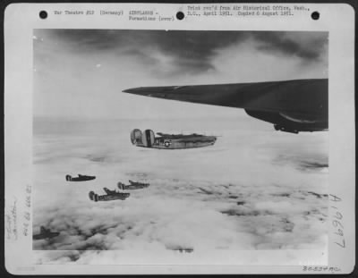 Consolidated > Consolidated B-24 Liberators Wing Their Way Over Clouds During A Mission On Saarbrucken, Germany.