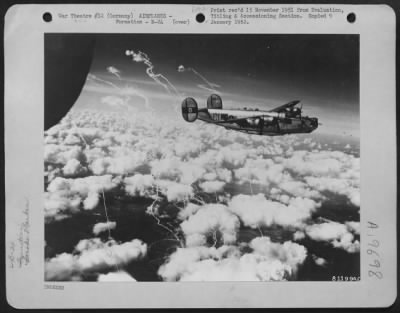 Consolidated > Trails From Smoke Markers Fill The Sky As Consolidated B-24S Of The 8Th Af Reach Their Target During A Raid On Enemy Installations Somewhere In Germany.  392 Bomb Group.  576 Bomb Sqd = (Ci)