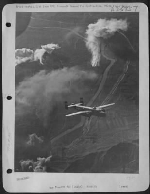 Thumbnail for Consolidated > With A Trail Of Fire And Smoke Behind It, This North American B-25 Mitchell Of The 12Th Air Force Heads For Its Home Base After Smashing At The Motta Di Livenza Bridge, 30 Miles Northeast Of Venice, On 11 Dec. 1944.