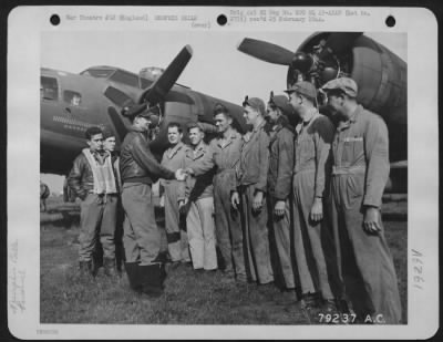 Thumbnail for General > Capt. Robert K. Morgan Of Asheville, North Carolina, Pilot Of The Boeing B-17 "The Memphis Belle" Bids Farewell To His Ground Crew Before Leaving For The United States After Completing His 25Th Mission.  They Are, Left To Right: Cpl. Oliver C. Champion Of