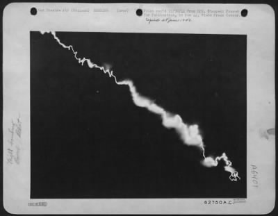 Thumbnail for V-1 Over England > The Flaming Wake Of A German Flying Bomb As It Plunged Toward The Earth.  Setting Up A Time-Exposure, Seconds Before The Bomb Started Its Power Dive, The Photographer Ran To A Near By Shelter And Arrived There As The Weapon Exploded In An Adjacent Clearin