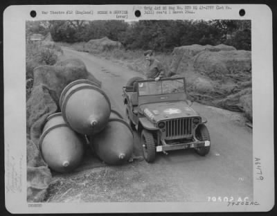 General > This Jeep Shows The Comparative Size Of 4000-Pound Block Busters At An 8Th Air Force Service Command Depot In Sharnbrook, England.  Sgt. Dow Flint Of St. Petersburg, Florida Is Driver Of The Jeep.  7 July 1943.