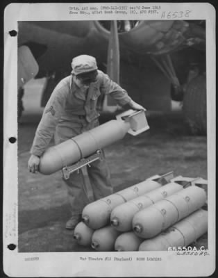 General > A Corporal Assigned To The Armament Section Of The 612Th Bomb Squadron, 401St Bomb Group, Unloads Bombs Under The Fuselage Of A Boeing B-17 "Flying Fortress" England, 8 January 1944.