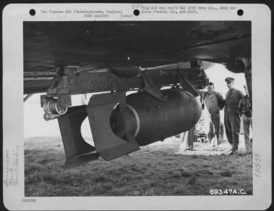 General > Armorers Of The 91St Bomb Group Load 1,000 Lb. Bombs On The New External Bomb Rack, Under The Wing Of A Boeing B-17 "Flying Fortress" At The 91St Bomb Group Base In Basinbourne, England.  14 September 1943.