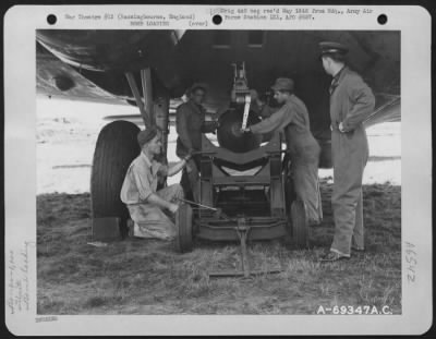 General > Armorers Of The 91St Bomb Group Load 1,000 Lb. Bombs On The New External Bomb Rack, Under The Wing Of A Boeing B-17 "Flying Fortress" At The 91St Bomb Group Base In Basinbourne, England.  14 September 1943.