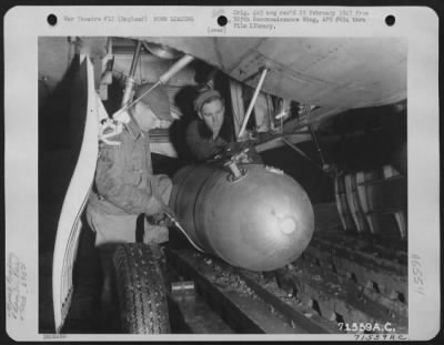 General > Armorers Of The 390Th Bomb Group Load Fire Bombs Into The Bomb Bay Of A Boeing B-17 "Flying Fortress" At An 8Th Air Force Base In England.  15 April 1945.
