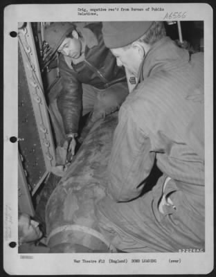 General > Air Force Ground Crew Of The 305Th Bomb Group Load A Bomb On A Boeing B-17 "Flying Fortress" At An 8Th Bomber Command Air Base Somewhere In England.  16 December 1943.