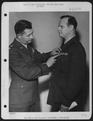Awards > Maj Gen Edward W Anderson Presenting The Air Medal To Lt. Swinney At Burtonwood Air Force Base.  England.