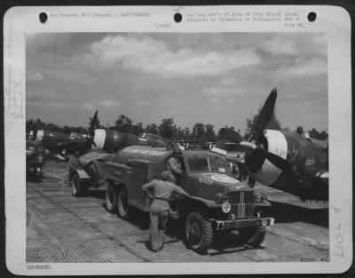 Thumbnail for Refueling > A row of P-47 fighter planes refuel after landing for the first time at their new base in France. Their main job is support of our ground troops.