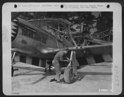 Thumbnail for Tires & Wheels > S/Sgt. Harold Staugler, crew chief, of Fort Recovery, Ohio, checks the wheel assembly on a North American P-51 Mustang of the 9th Air Force at a base somewhere in France.