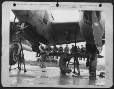 Thumbnail for Tires & Wheels > The ground crewmen sitting on the tail of this U.S. Army 9th Air Force P-38 Lightning fighter-bomber undergoing reconditioning are not taking it easy, as the photo might indicate. The ship's landing gear is being checked, an operation that requires