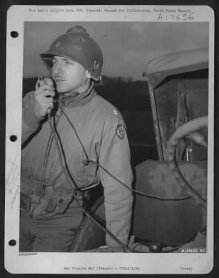 General > Major Frank L. Martine, a 9th Air Force Air Ground Coordination officer attached to a ground unit, directs 9th Air Force fighter-bombers to targets in the Siegfried Line area. Major Martine, of 140 Roseville Ave., Newark, N.J., is shown here using